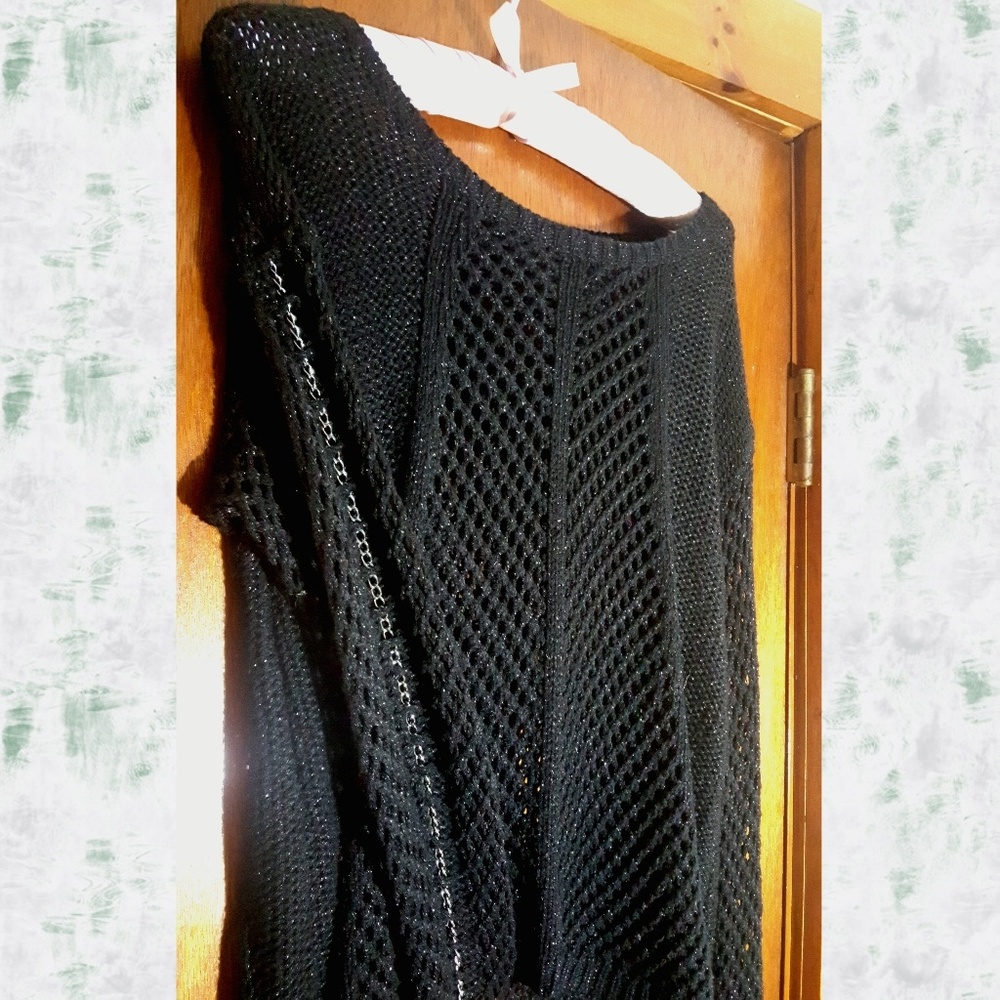 Sparkly open-knit sweater with chain sleeves